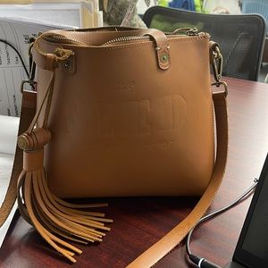 Feed leather over the shoulder bag